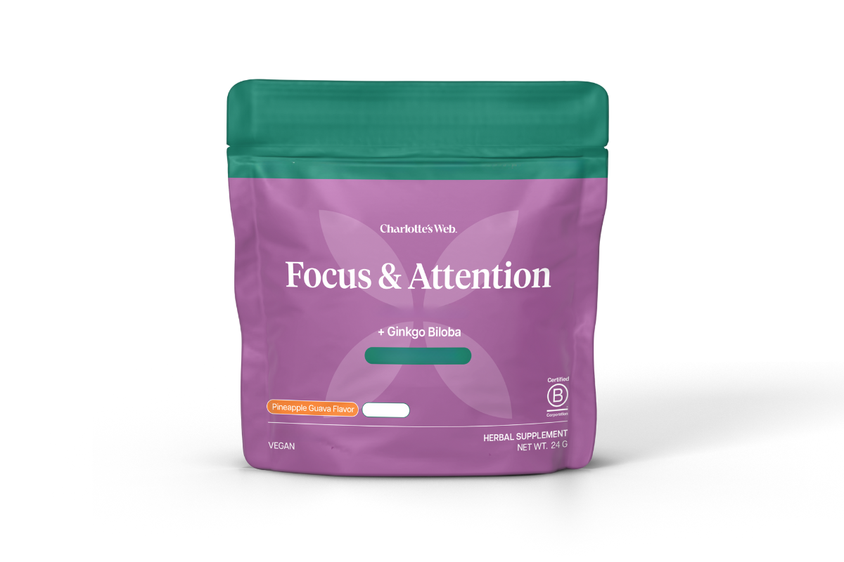 Purple package with green lid labeled 'Focus & Attention' on a white background